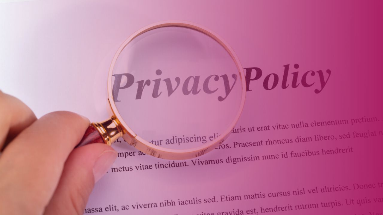 A privacy policy with a person holding a magnifying glass above it